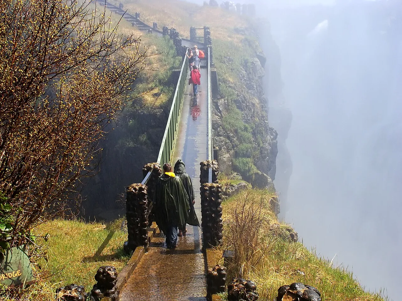 The Knife-Edge Bridge footbridge over a chasm on the Zambian side of Victoria Falls, with spray rising from the gorge below.
