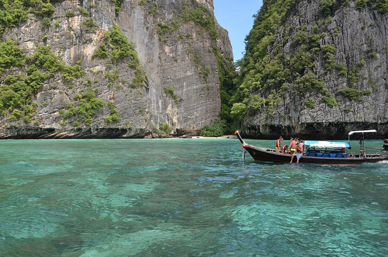 Limestone cliffs rising from turquoise water at the Phi Phi Islands.