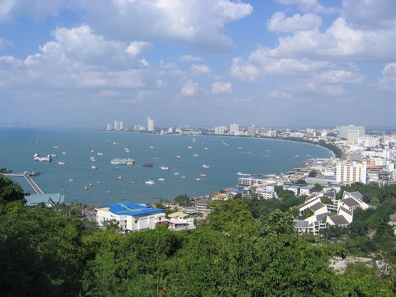 Aerial view of Pattaya Beach and the curved coastline from Phra Tamnak Hill viewpoint.