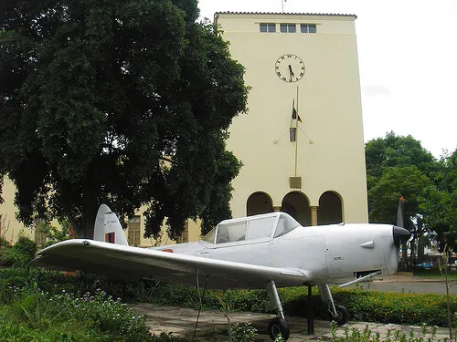 The front entrance of the Livingstone Museum in Livingstone, Zambia, with a preserved Zambian Air Force aircraft on display outside.